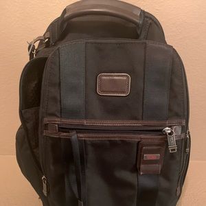 Tumi Sling ballistic nylon leather trims and black on the front